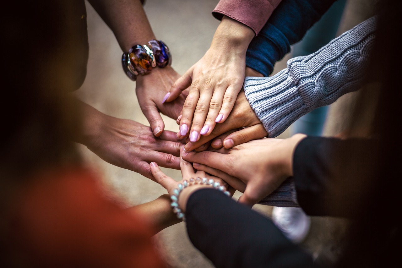 Volunteers and participants working together in a group setting.